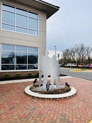 Statue in front of building
