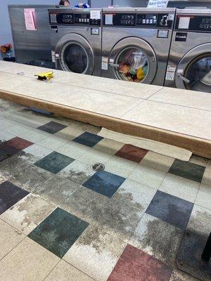 Disgusting floors. 3 out of 4 of these big load washers out of order and both of the only larger load front loaders were also out of order.