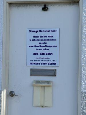 False phone number posted outside the main office door of the storage facility