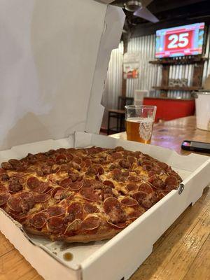 Large pepperoni and sausage pizza