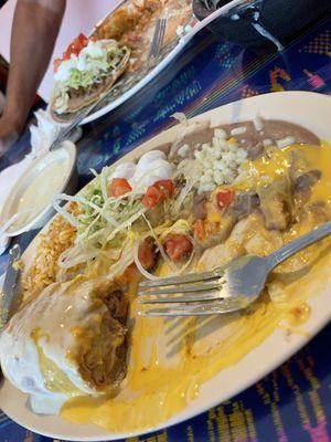 Chimichanga with Refried Beans & Rice along with a Cup of Queso Blanco Cheese Dip