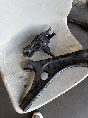 Broken junkyard control arm