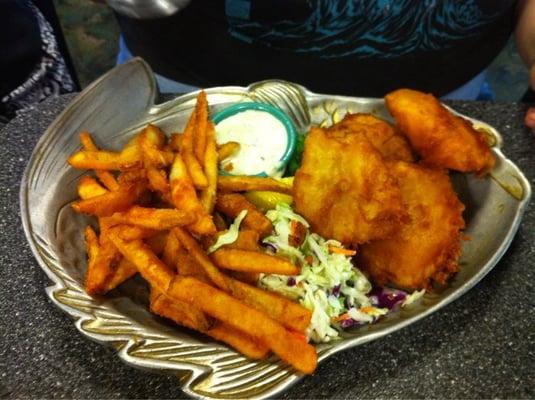 Four pieces of fish in the fish and chips.