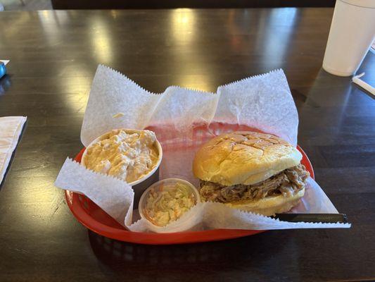 North Carolina BBQ sandwich with a side of potato salad