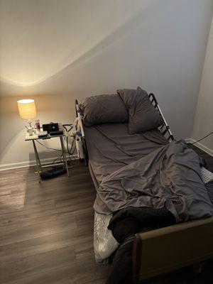 Electrical medical bed. This senior (86) is waiting for his furniture to be delivered from Florida and was sleeping on cot.