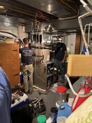 The Uber Company team at work installing the new HVAC system in our cramped, older basement. They made it happen!