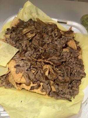 Asada super nachos w/ toppings on side