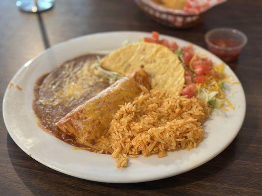 Two item combination plate: chicken enchilada and beef taco with rice and beans. Comfort food! Tasty.