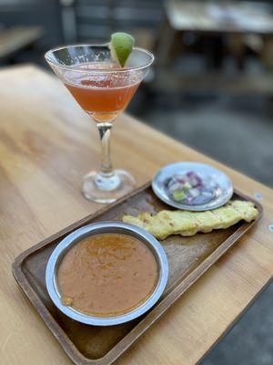 Chicken satay and a cocktail. August 2024