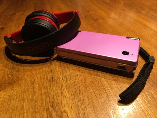 In this photo I am displaying my completed DSI shell swap and customized Beats solo 2 Headphones.