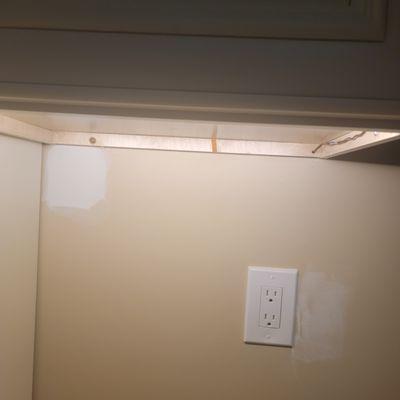 Screws on cabinet rail instead of inside cabinet. Plus the nails ruined the veneer on brand new cabinets