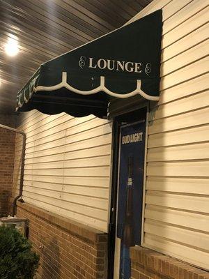 Minute advert of a bar, but the door is locked. Don't fret! Just go in through the front, your beer is waiting.