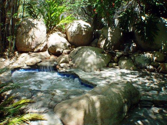 Spa and Waterfall nestled in Boulders in Vista, CA #Spa #Waterfall