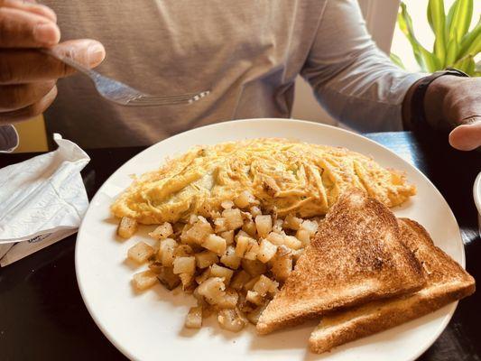 Turkey veggie omelet with hash browns and toast