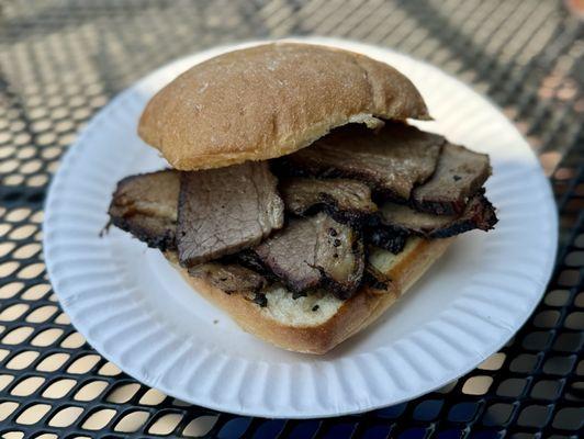 Smoked brisket on ciabatta with grilled onions