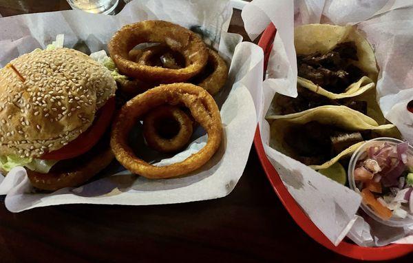 Burger and onion rings and carne asada tacos