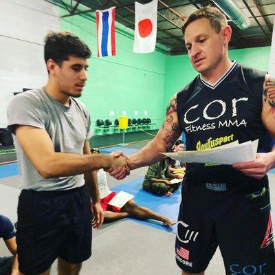 Member receiving certificate for promotion