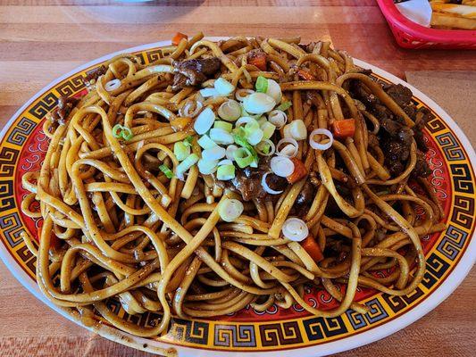Garlic noodles with beef, hold the peas. It was, FANTASTIC! Huge portions too