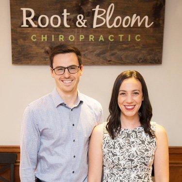 Chiropractors Dr. Lauren Molinaro and Dr. Weston Shelton at Root & Bloom Chiropractic