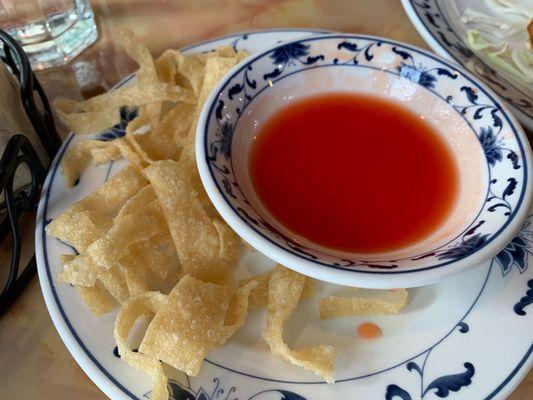 Complimentary crisps and sweet and sour sauce