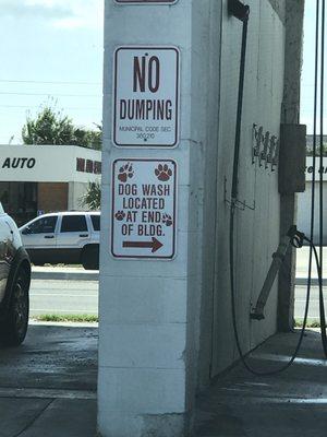 Sign between self serve car wash