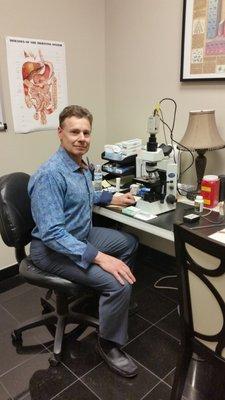 Dr. Thomas Brewer at his microscope