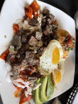 Chilaquiles with red sauce and steak