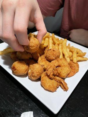 Fried shrimp platter with hush puppies and fries