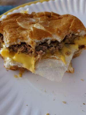 A piece of paper cooked inside my 4 Cheese Burger.