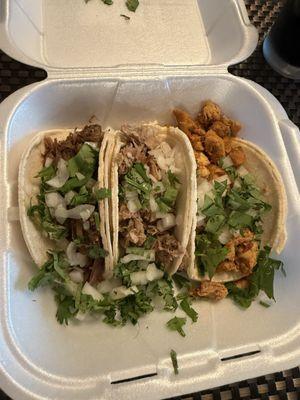 Barbacoa, pork and chicken taco.