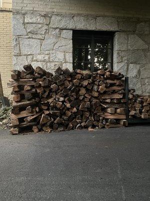 Door to door firewood delivery, stacked and stocked for the winter.