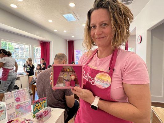 Owner Wendy, displaying one of the crafts!