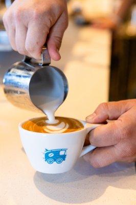 Cappuccino being poured at Bird Rock Coffee Roasters Encinitas