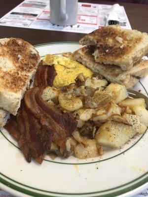 1 egg with cheese, home fries, homemade bread test, 3 pieces of bacon and coffee...just over $7.