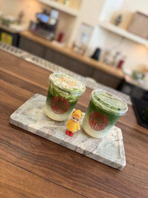 Matcha latte with banana foam top (left) and matcha latte (right)