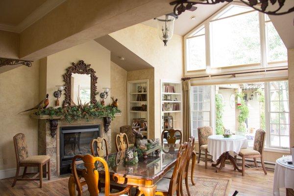 Vaulted dining room with views of the river and cliffs