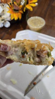 Inside the ham and cheese empanada