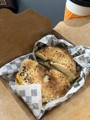 Delicious sausage, egg, and cheese sandwich on an everything bagel