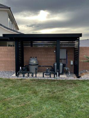 Solid top free standing awning covering pool equipment