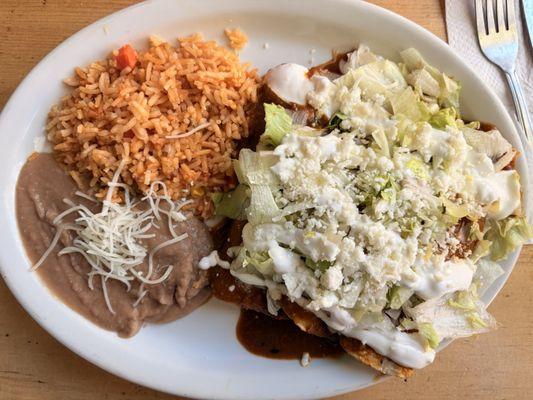 Cecina enchiladas with red sauce served with rice and beans. Meat was very tasty would recommend if you like carne asada.