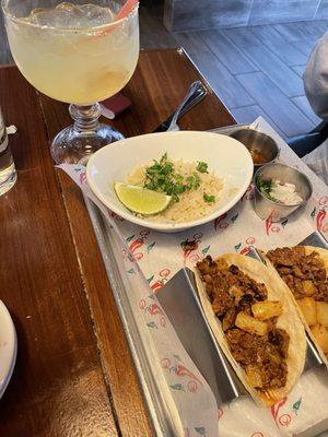Traditional street tacos with white rice and cilantro. Of course, can't leave out the margarita!