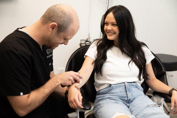 PA Michael Warren performing a routine skin check.