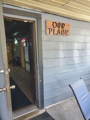 Entrance from rear through smoking patio