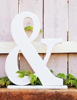 22" wooden ampersand in white. Makes a great wedding or engagement photo prop.