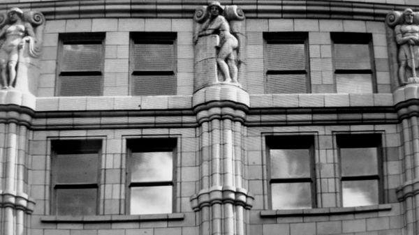 Terrace cotta figurines perched on the sixth floor