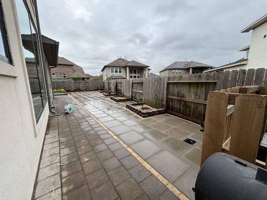 After installing 2x2 grey pavers and silver shell pavers on the outline. 3 layer blocks glued and raised drains up 10 inches