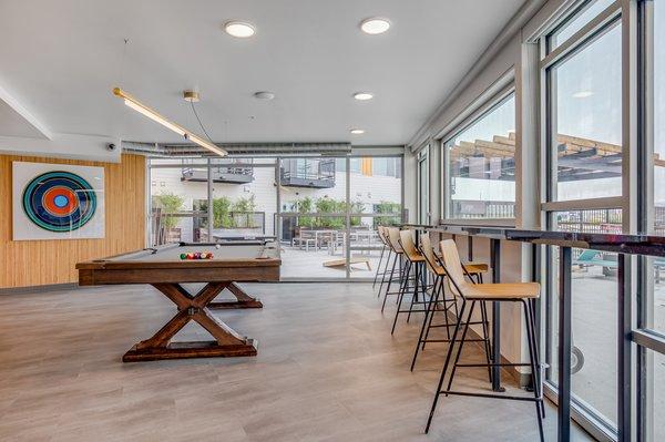 Billiards room with a view of outdoor space