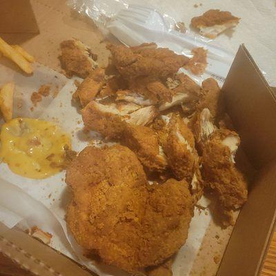 Petrified chunks of boneless unchewable, inedible chicken, that was called fried chicken dinner
