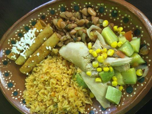 From the buffet : Queso fresco enchiladas, calabacita con pollo, rice, beans.