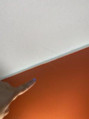 Spider web above the bed in room 132